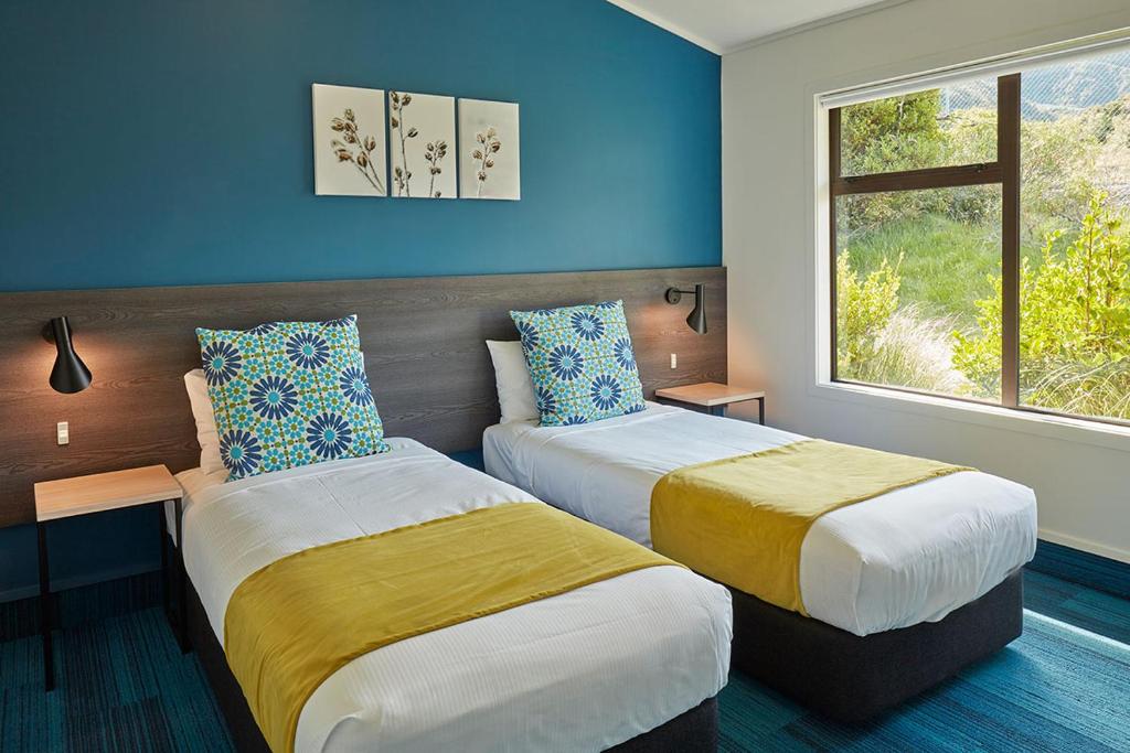 Postel nebo postele na pokoji v ubytování Mt Cook Lodge and Motels