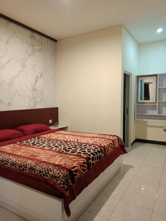 Tempat tidur dalam kamar di Chacha Homestay & Dormitory