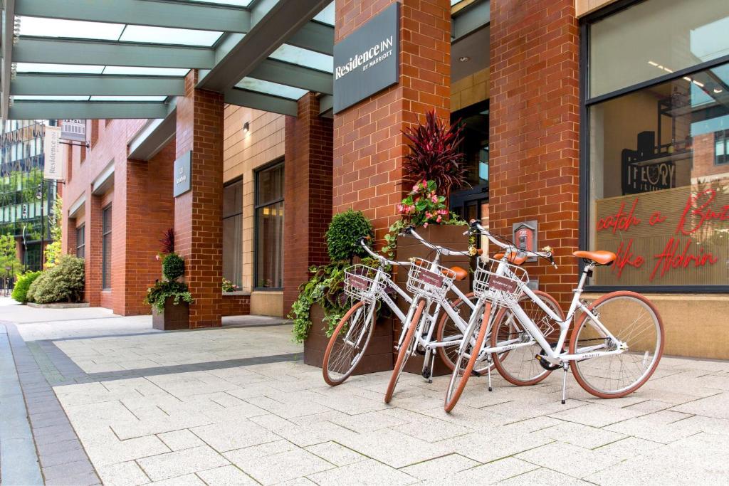 two bikes parked in front of a building at Residence Inn by Marriott Boston Cambridge in Cambridge