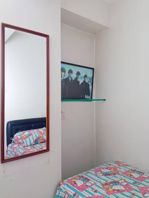Postel nebo postele na pokoji v ubytování COZY 2BR Pinewood Apt Jatinagor with Wi-Fi n Pool by 2ndHome