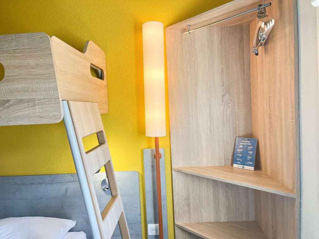 Postel nebo postele na pokoji v ubytování ibis budget Carcassonne La Cité