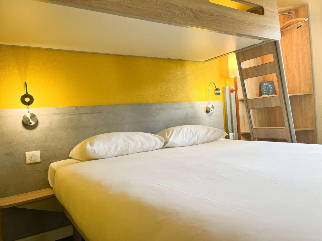 Postel nebo postele na pokoji v ubytování ibis budget Carcassonne La Cité