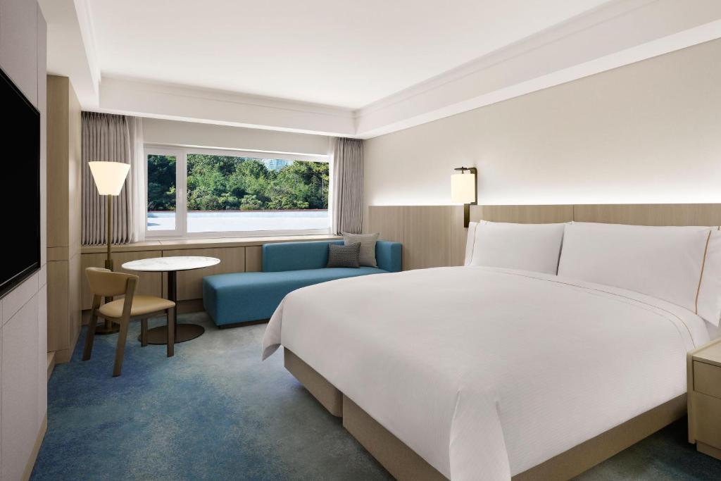 Postel nebo postele na pokoji v ubytování The Westin Josun Busan