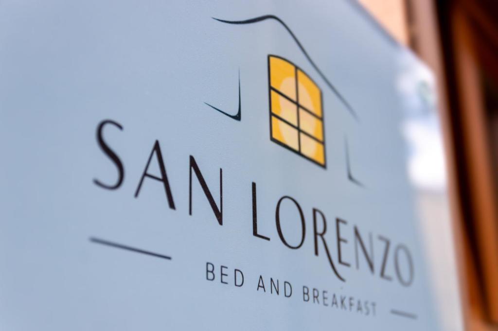 a bottle of san lorenzo wine with the words san lorenzo at San Lorenzo B & B in Ruoti