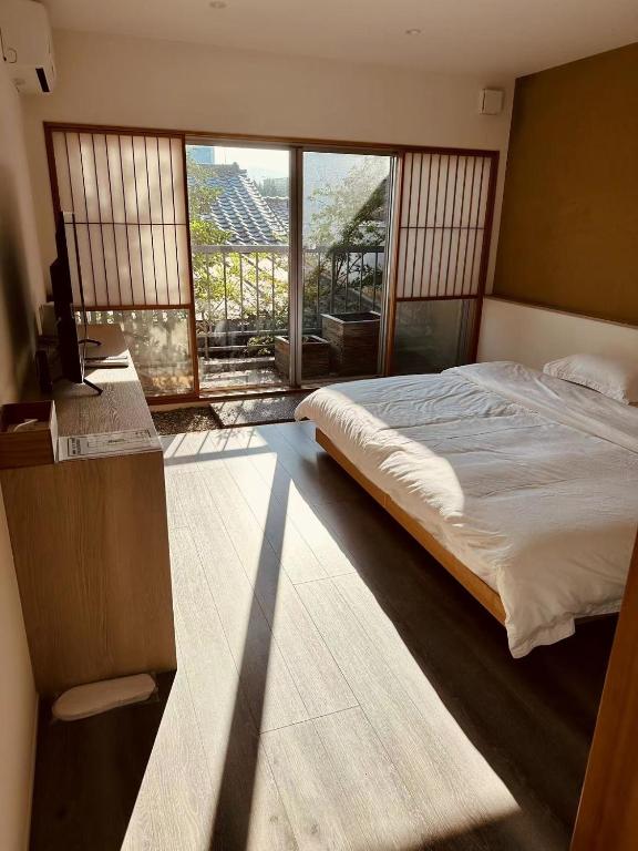 Postel nebo postele na pokoji v ubytování Hotel Shun