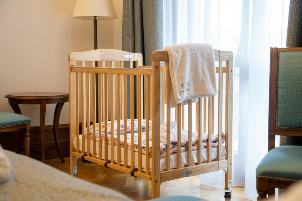 Postel nebo postele na pokoji v ubytování Hungarikum Hotel