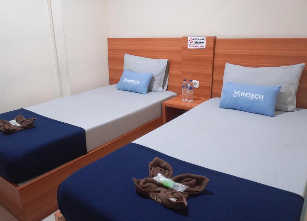 Postel nebo postele na pokoji v ubytování Intech Hostel