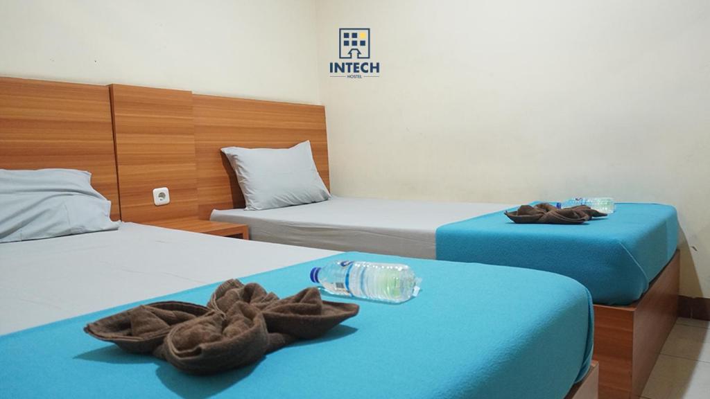 Postel nebo postele na pokoji v ubytování Intech Hostel