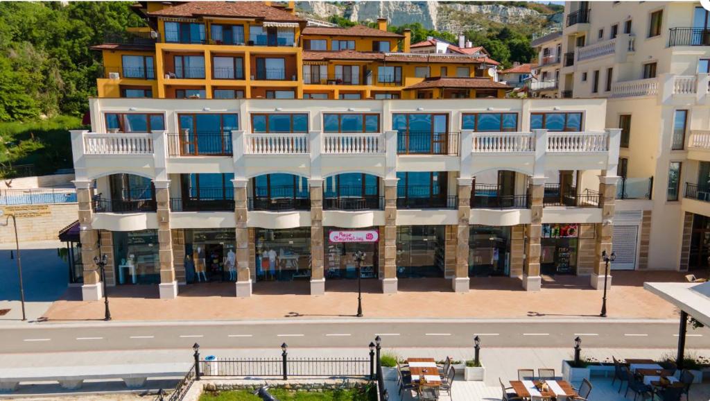 a large building with a street in front of it at Villa Maria in Balchik