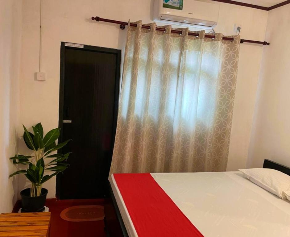 Postel nebo postele na pokoji v ubytování Olivia HomeStay