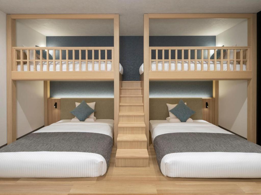 Postel nebo postele na pokoji v ubytování HOTEL MYSTAYS Iidabashi
