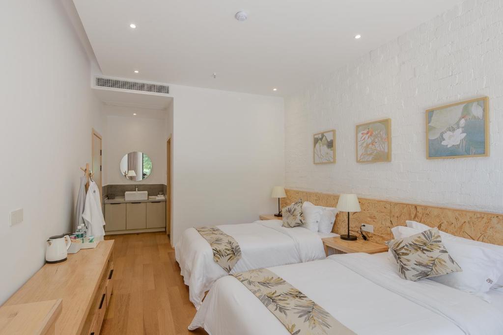 Postel nebo postele na pokoji v ubytování Vretreats yunxishang Boutique Hotel
