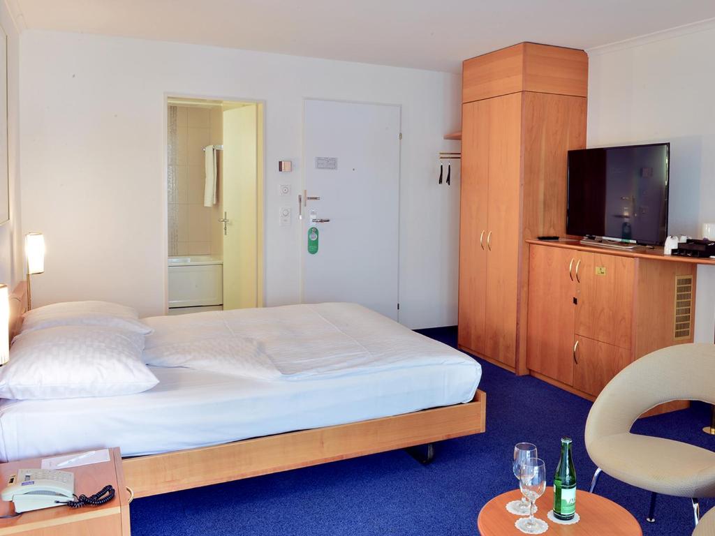 Postel nebo postele na pokoji v ubytování Residence Zug