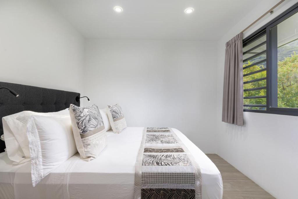 Postel nebo postele na pokoji v ubytování Raina Lodge - Fare Hereiti - Piscine privée