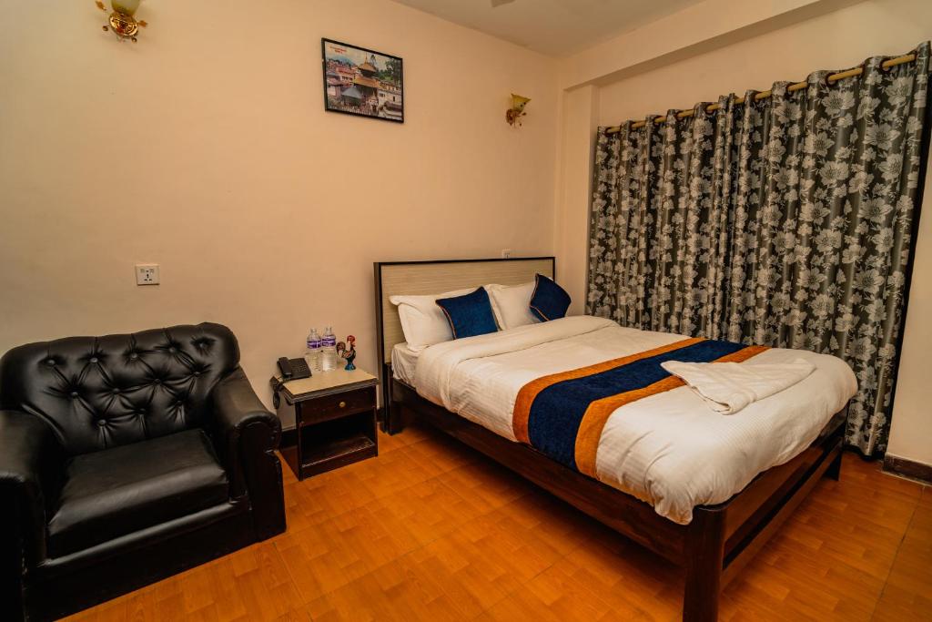 Postel nebo postele na pokoji v ubytování Karma Travellers Home
