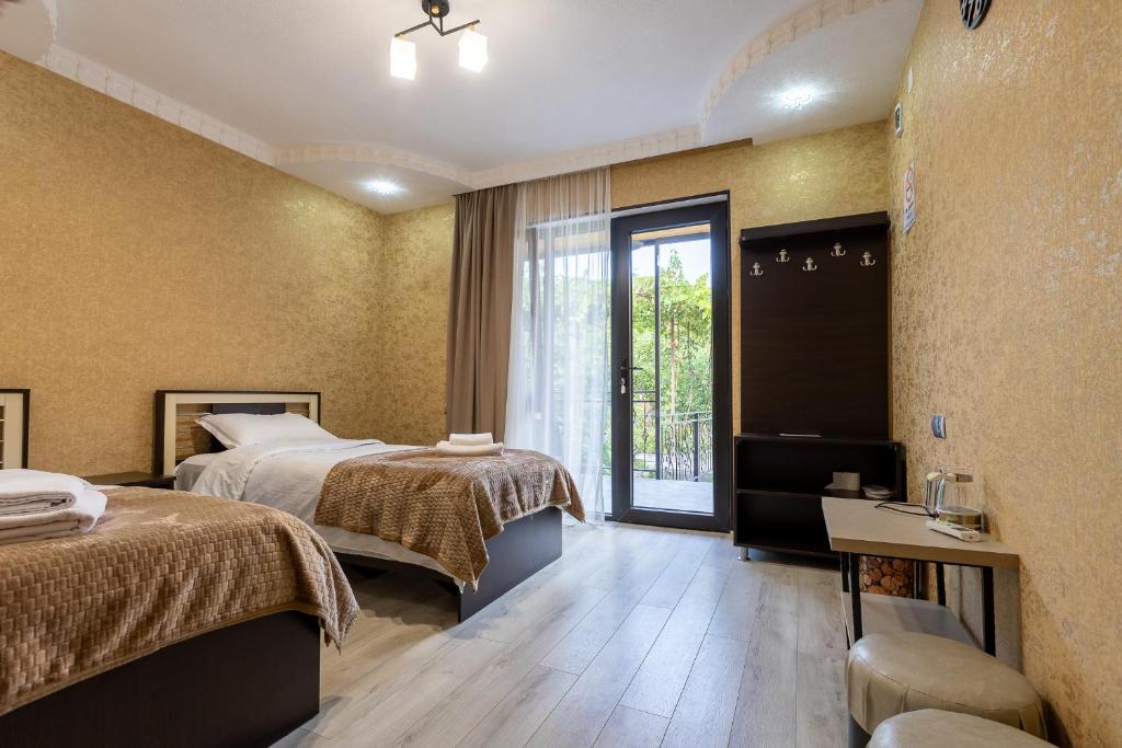 Postel nebo postele na pokoji v ubytování Hotel Tsiskari