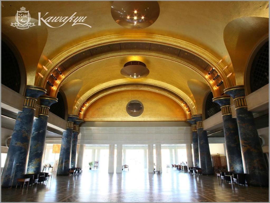 a large lobby with a large room with tables and chairs at Hotel Kawakyu in Shirahama