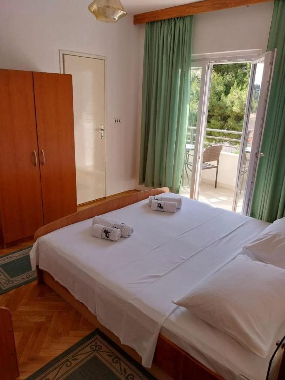 Postel nebo postele na pokoji v ubytování Apartments Josip