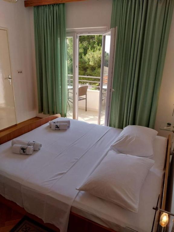 Postel nebo postele na pokoji v ubytování Apartments Josip