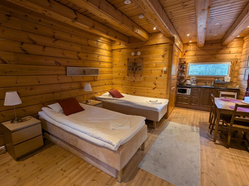 Postel nebo postele na pokoji v ubytování Santa's Little Village - Hotel Uitonniemi