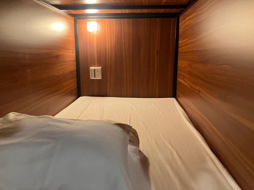 Postel nebo postele na pokoji v ubytování Hanamachi guest house