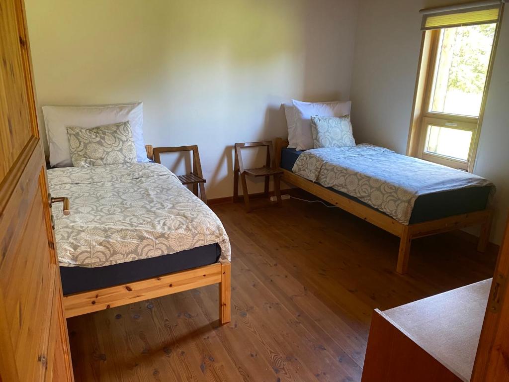 Postel nebo postele na pokoji v ubytování Kasteheina kodu