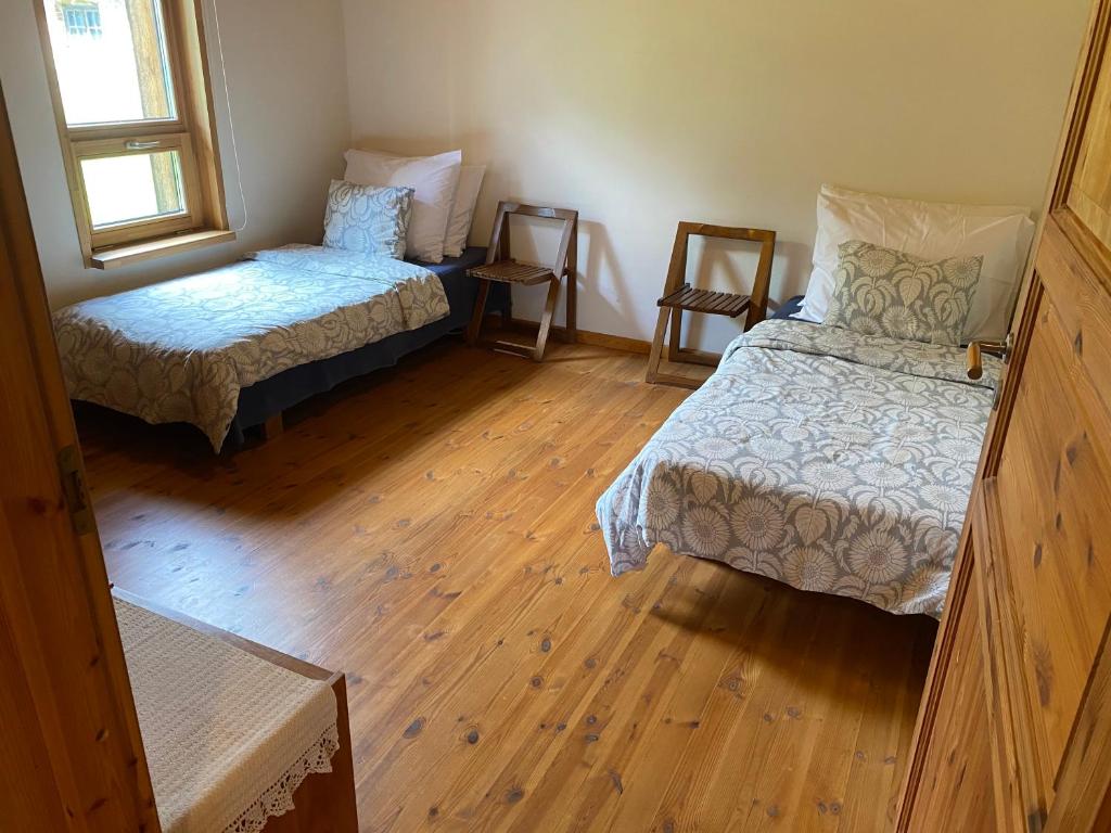 Postel nebo postele na pokoji v ubytování Kasteheina kodu