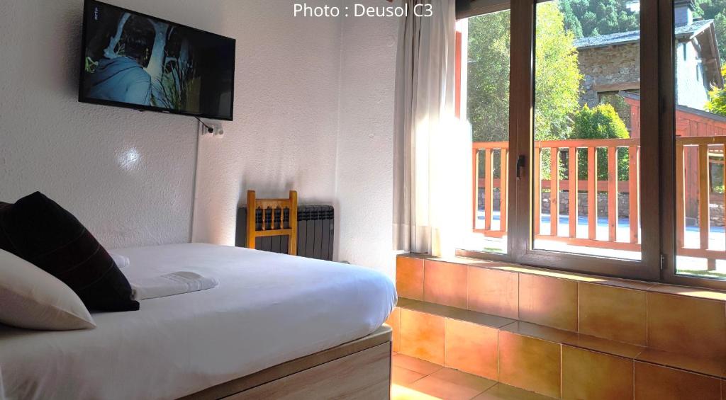 Postel nebo postele na pokoji v ubytování AC Apartaments Vall d'Incles