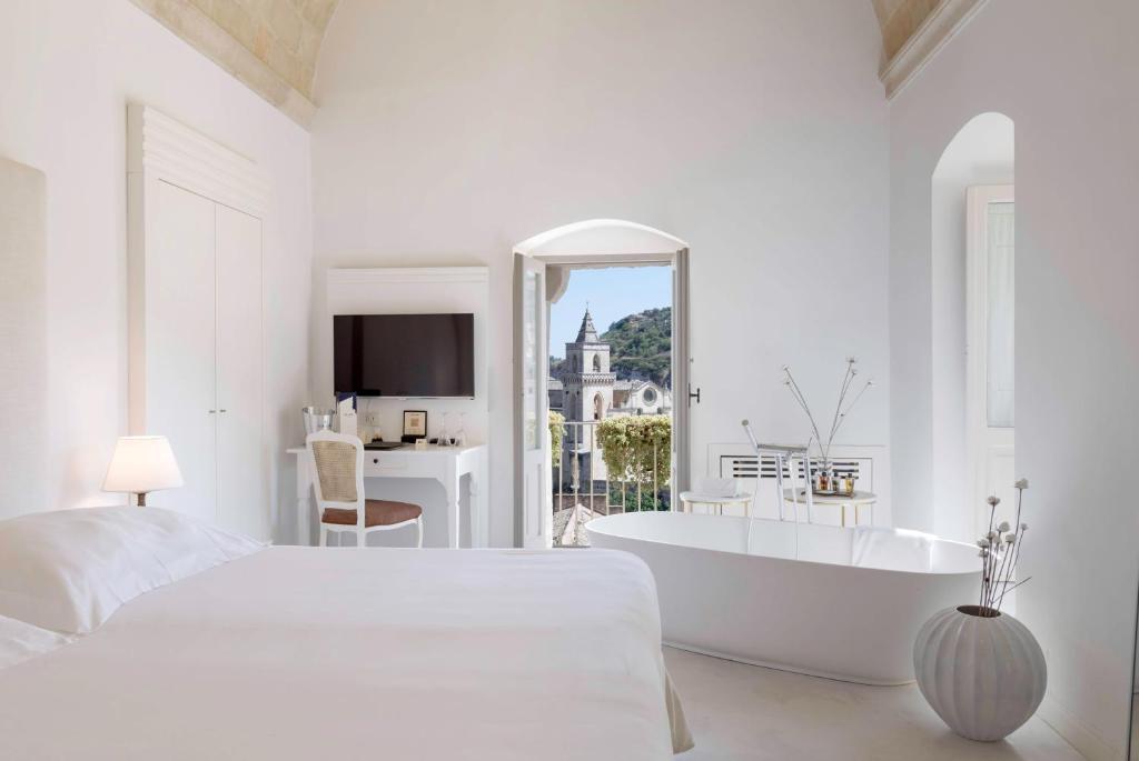 Postel nebo postele na pokoji v ubytování Sant'Angelo, Matera - Small Luxury Hotels