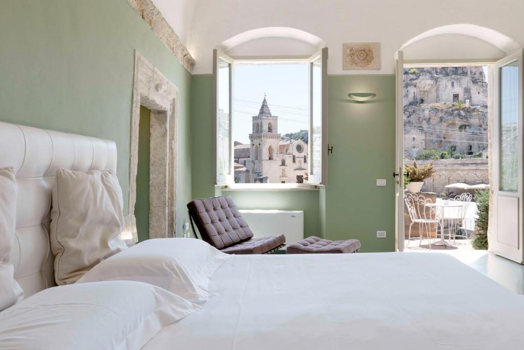 Postel nebo postele na pokoji v ubytování Sant'Angelo, Matera - Small Luxury Hotels