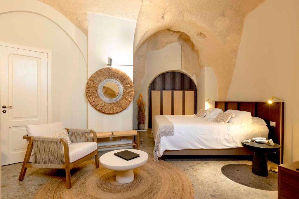 Postel nebo postele na pokoji v ubytování Sant'Angelo - Le Residenze