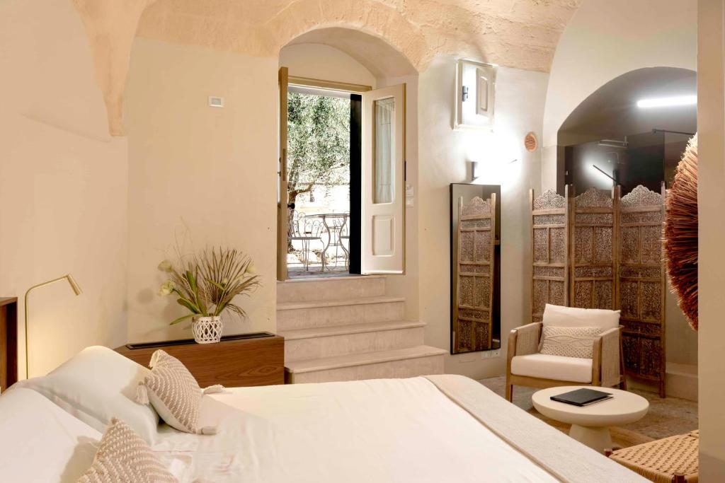 Postel nebo postele na pokoji v ubytování Sant'Angelo - Le Residenze
