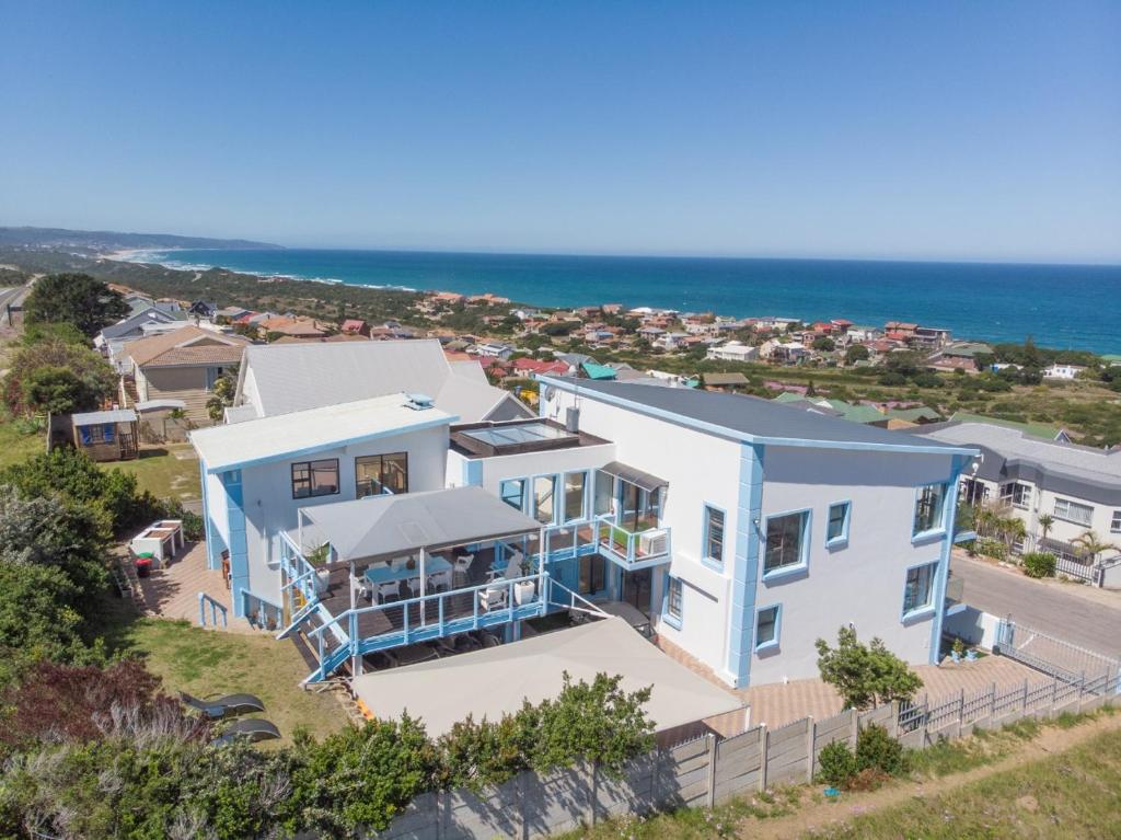 an aerial view of a house with the ocean in the background at Blue Star Villa in Tergniet