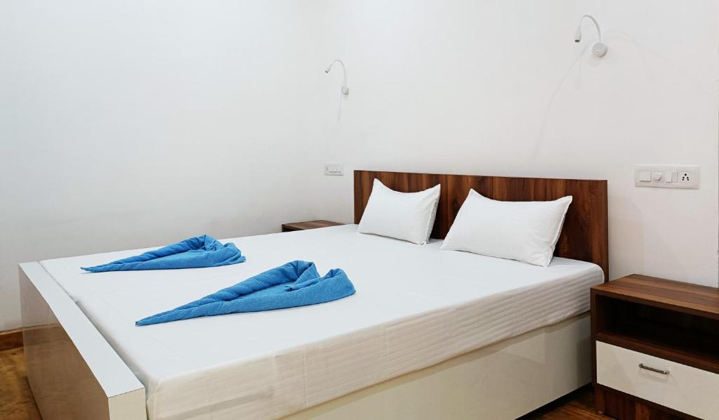 Postel nebo postele na pokoji v ubytování Koshy's beach front Homestay