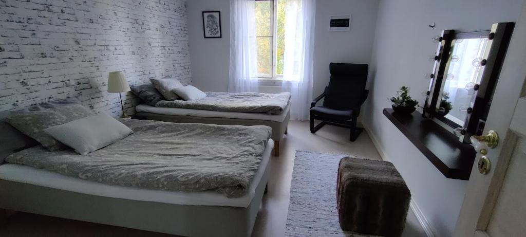 Postel nebo postele na pokoji v ubytování Lottefors Logi
