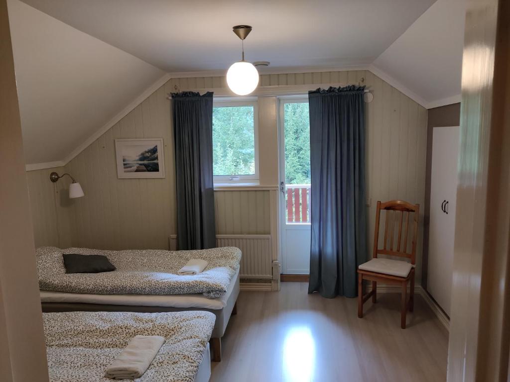 Postel nebo postele na pokoji v ubytování Lottefors Logi