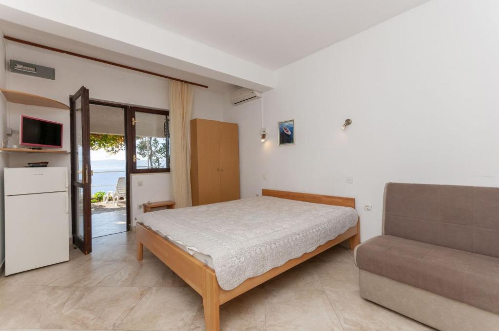 Posteľ alebo postele v izbe v ubytovaní Apartments Niko