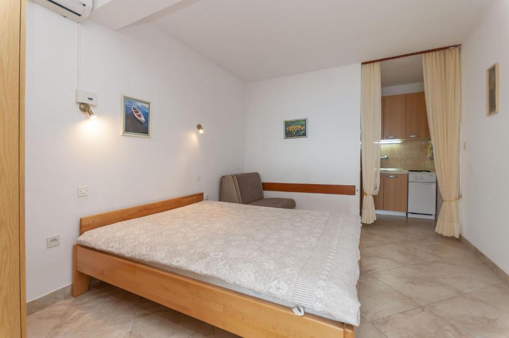 Posteľ alebo postele v izbe v ubytovaní Apartments Niko
