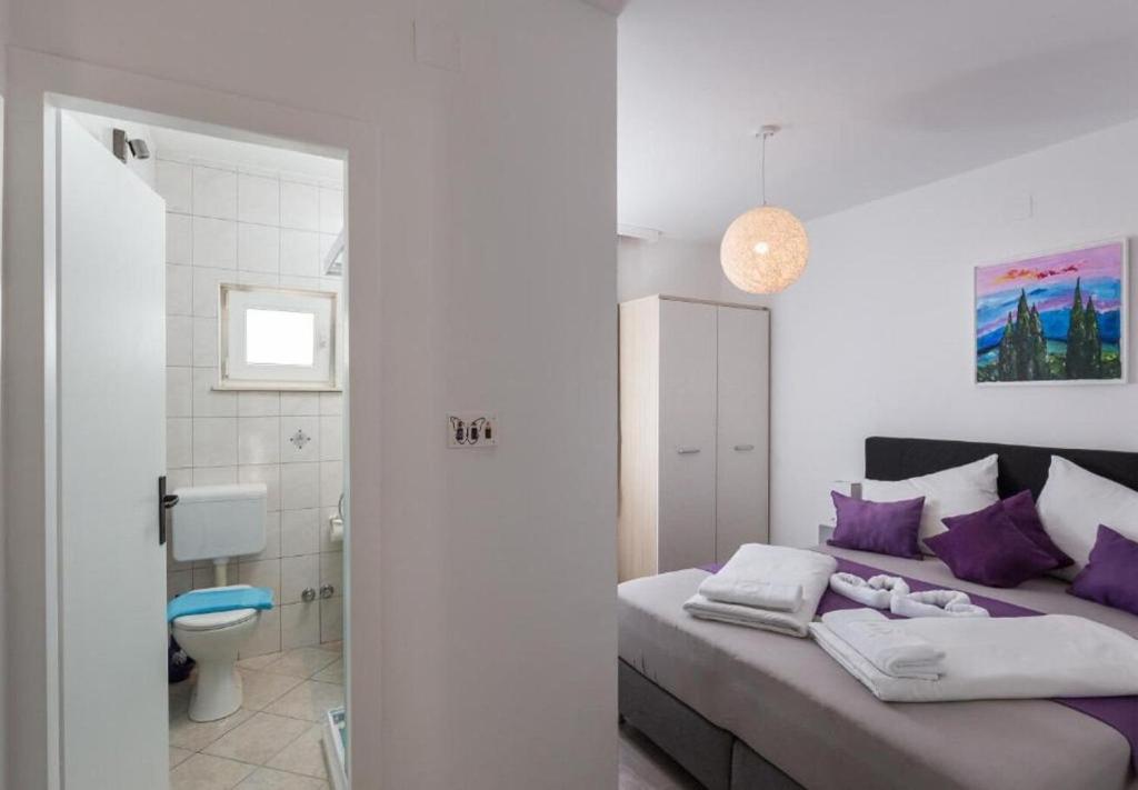 Posteľ alebo postele v izbe v ubytovaní Apartments Ante