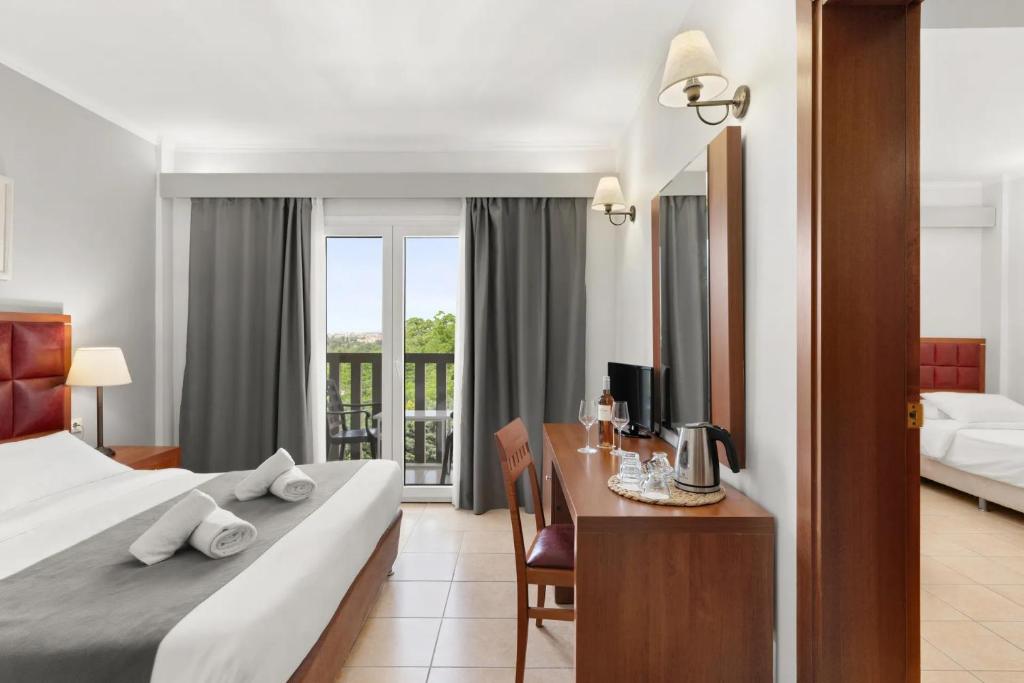 Letto o letti in una camera di Ariti Grand Hotel