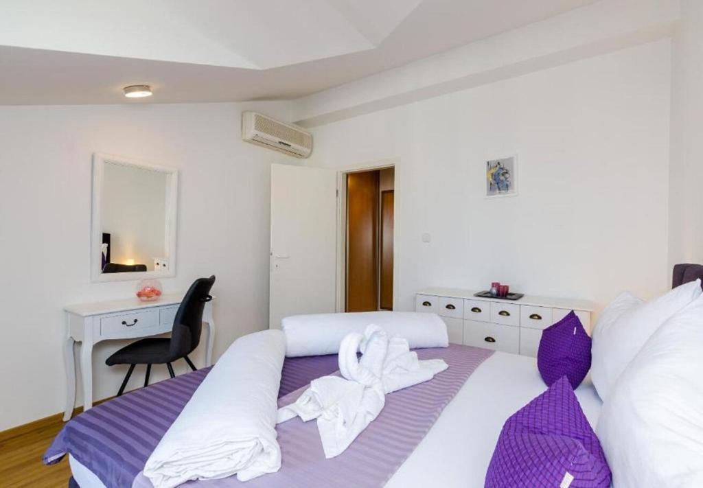 Posteľ alebo postele v izbe v ubytovaní Apartments Ante