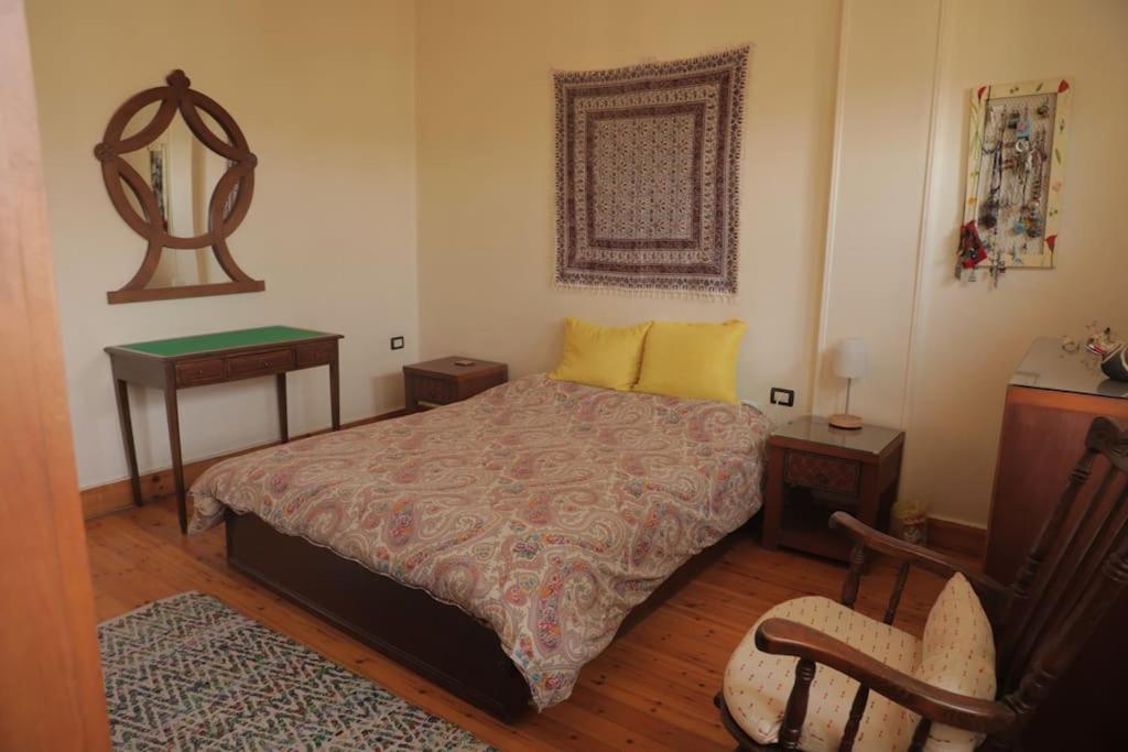 Postel nebo postele na pokoji v ubytování Artistic apartment with a terrace in Downtown