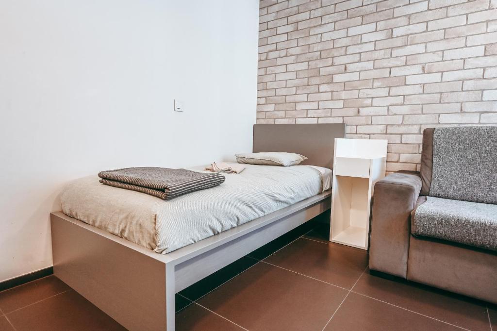 Postel nebo postele na pokoji v ubytování Wake Up Esch City