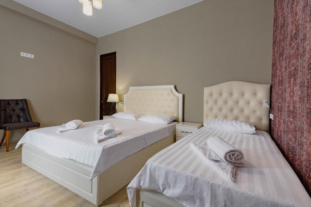 Postel nebo postele na pokoji v ubytování Urban Villa By Umbrella