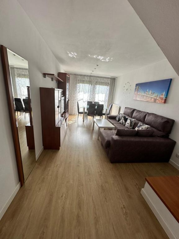 a living room with a couch and a table at Precioso duplex en Oviedo WIFI in Oviedo
