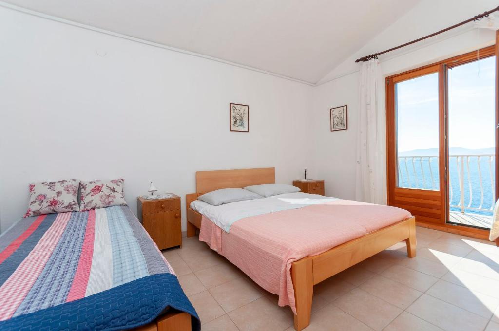 Posteľ alebo postele v izbe v ubytovaní Apartments Niko