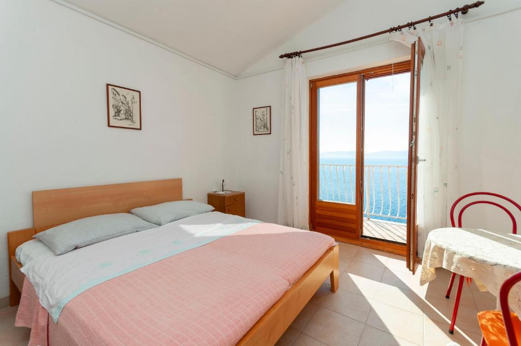 Posteľ alebo postele v izbe v ubytovaní Apartments Niko