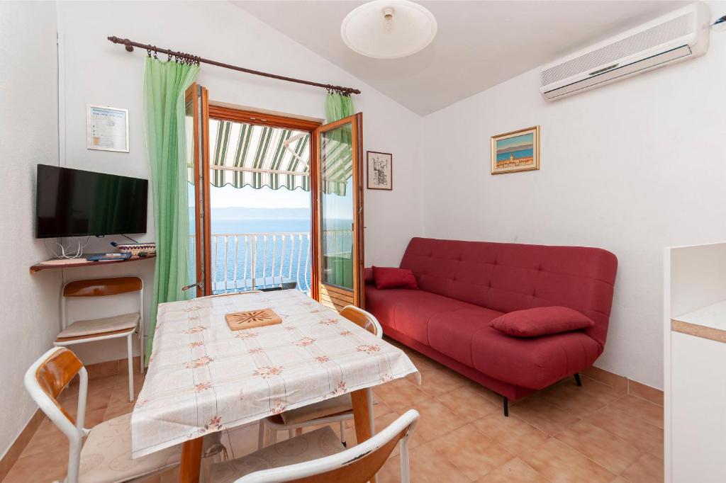 Televízia a/alebo spoločenská miestnosť v ubytovaní Apartments Niko