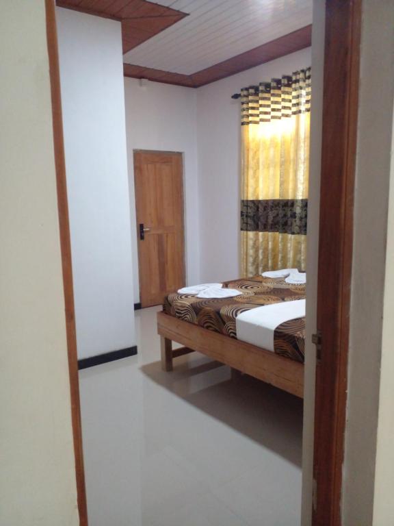 Postel nebo postele na pokoji v ubytování Mango House River Inn Negombo