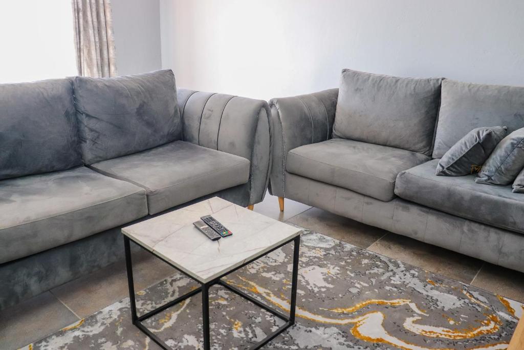 Posezení v ubytování Centrally Located Luxurious Unit in CBD